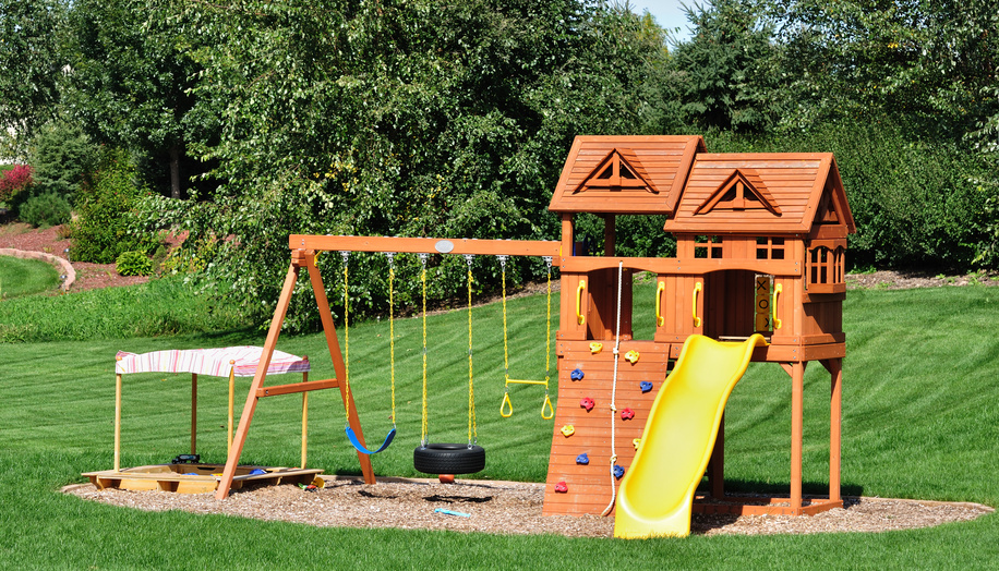 A kids' playground in a grassy area.