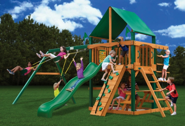 Wooden playground set with swings and slide for kids.