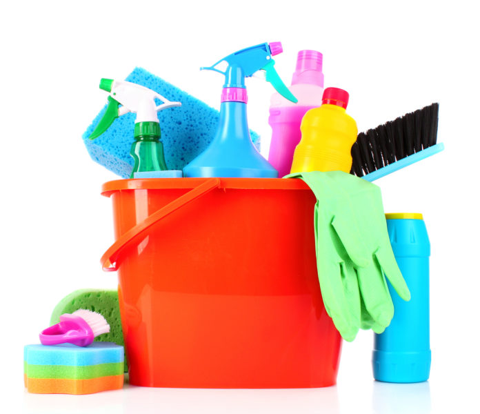 Cleaning supplies in a bucket on a white background suitable for clean windows.