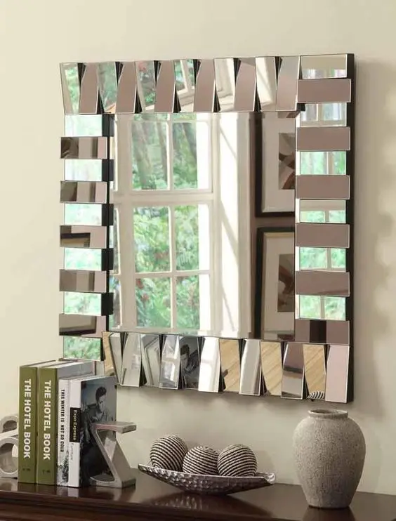Mirror with a square frame and a vase on top, perfect for adding unique decor to your space.