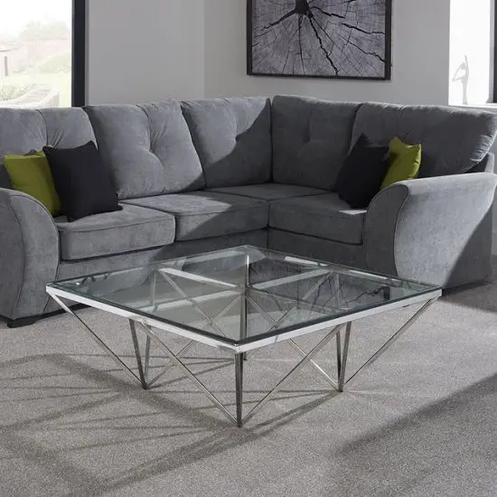 A modern living room with an amazing glass coffee table.