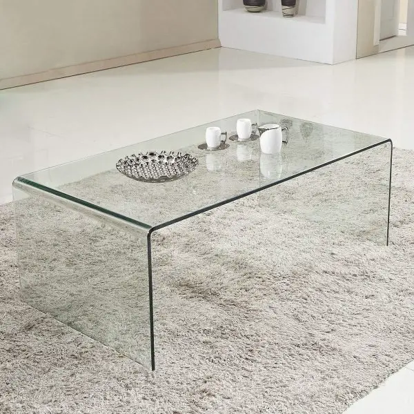 An amazing glass coffee table in a living room.