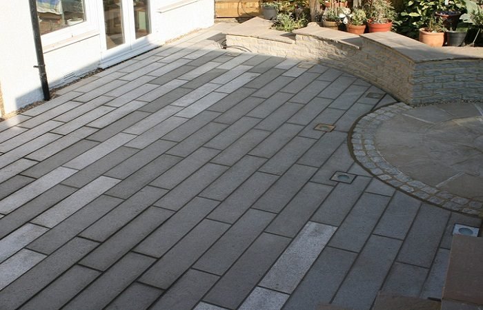 A patio with grey pavers.