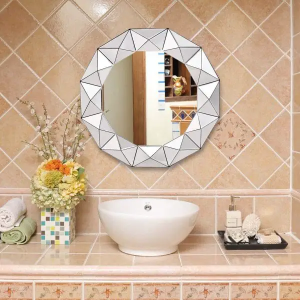 A bathroom with a tiled wall and mirror ideas.