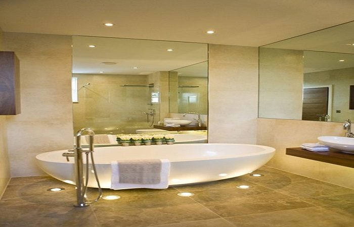 A large bathroom with ample lighting.