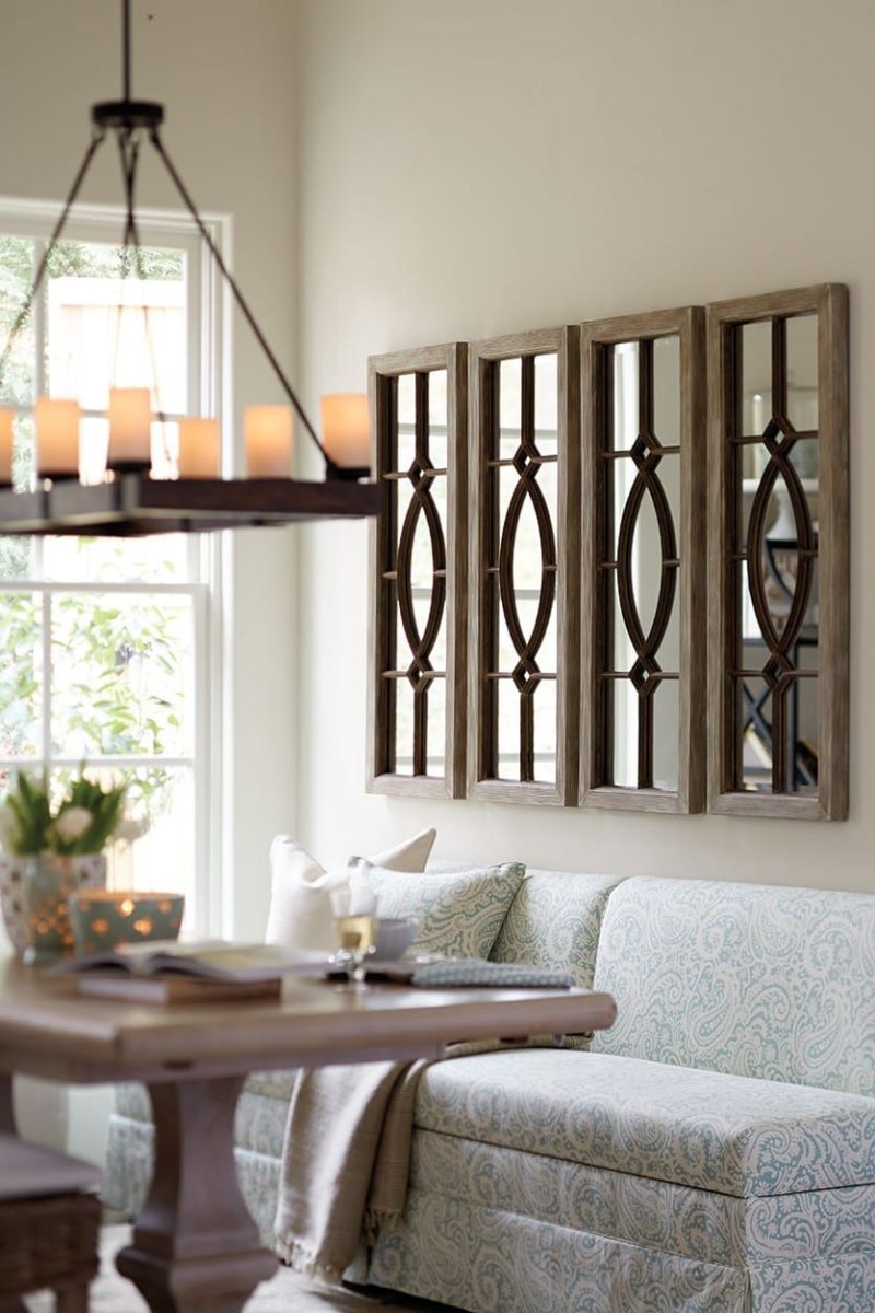 A dining room with mirrors for decorative ideas.