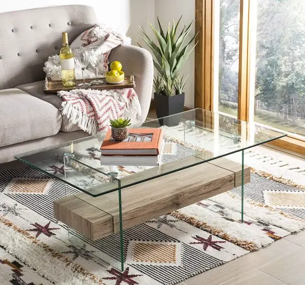 An amazing glass coffee table in a living room.