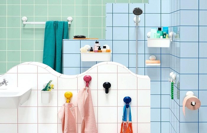 A colorful bathroom with tiled walls.