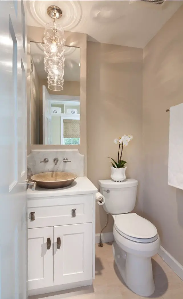A small white bathroom with a toilet and sink.
