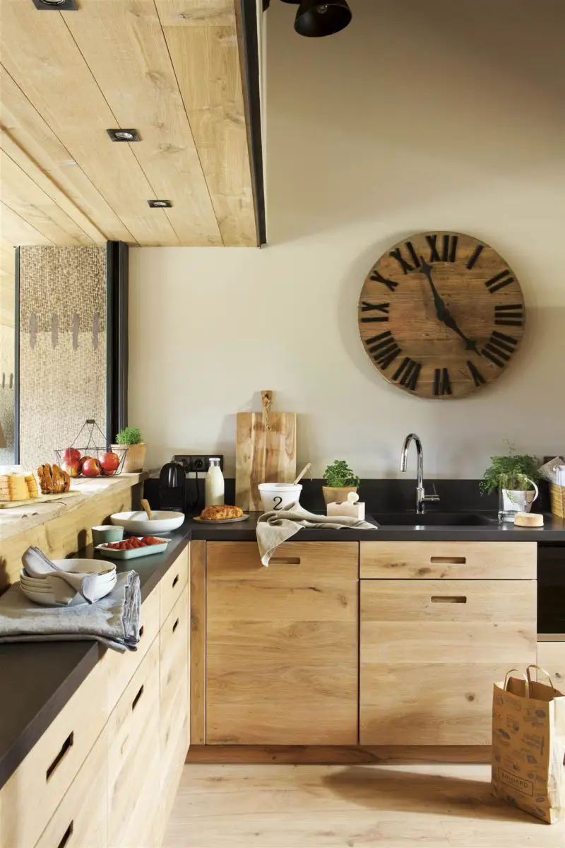 Renovate the kitchen with wooden cabinets and a clock on the wall.