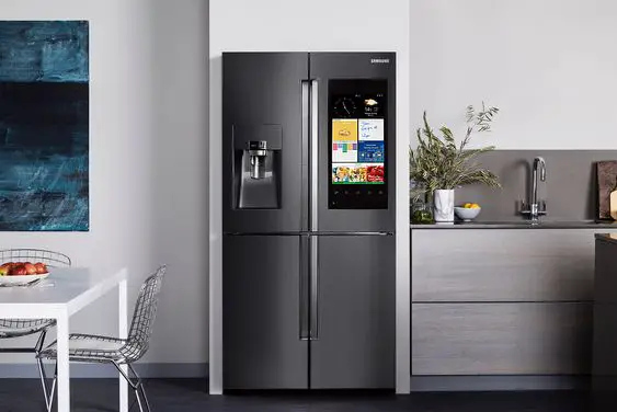 A smart kitchen with a refrigerator and a microwave.