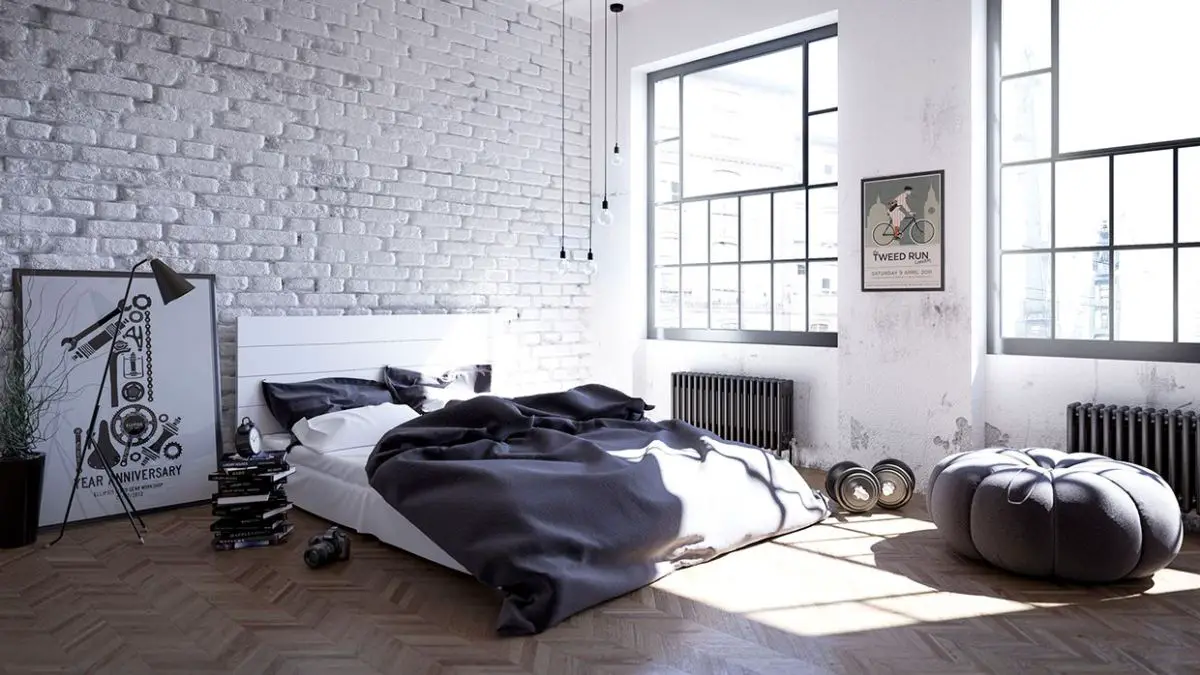 A Scandinavian-inspired bedroom with a brick wall.