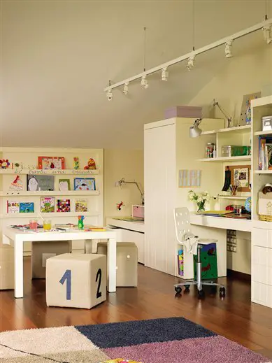 A kid's room with a desk and toys.
