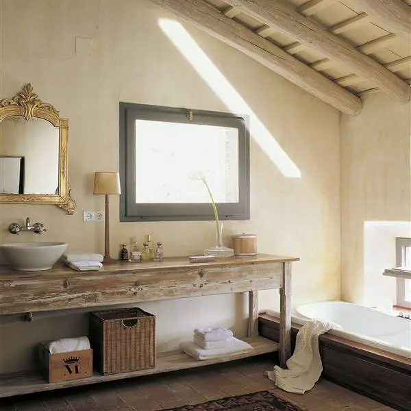 A bathroom with wooden beams and a wooden sink infested by woodworm.