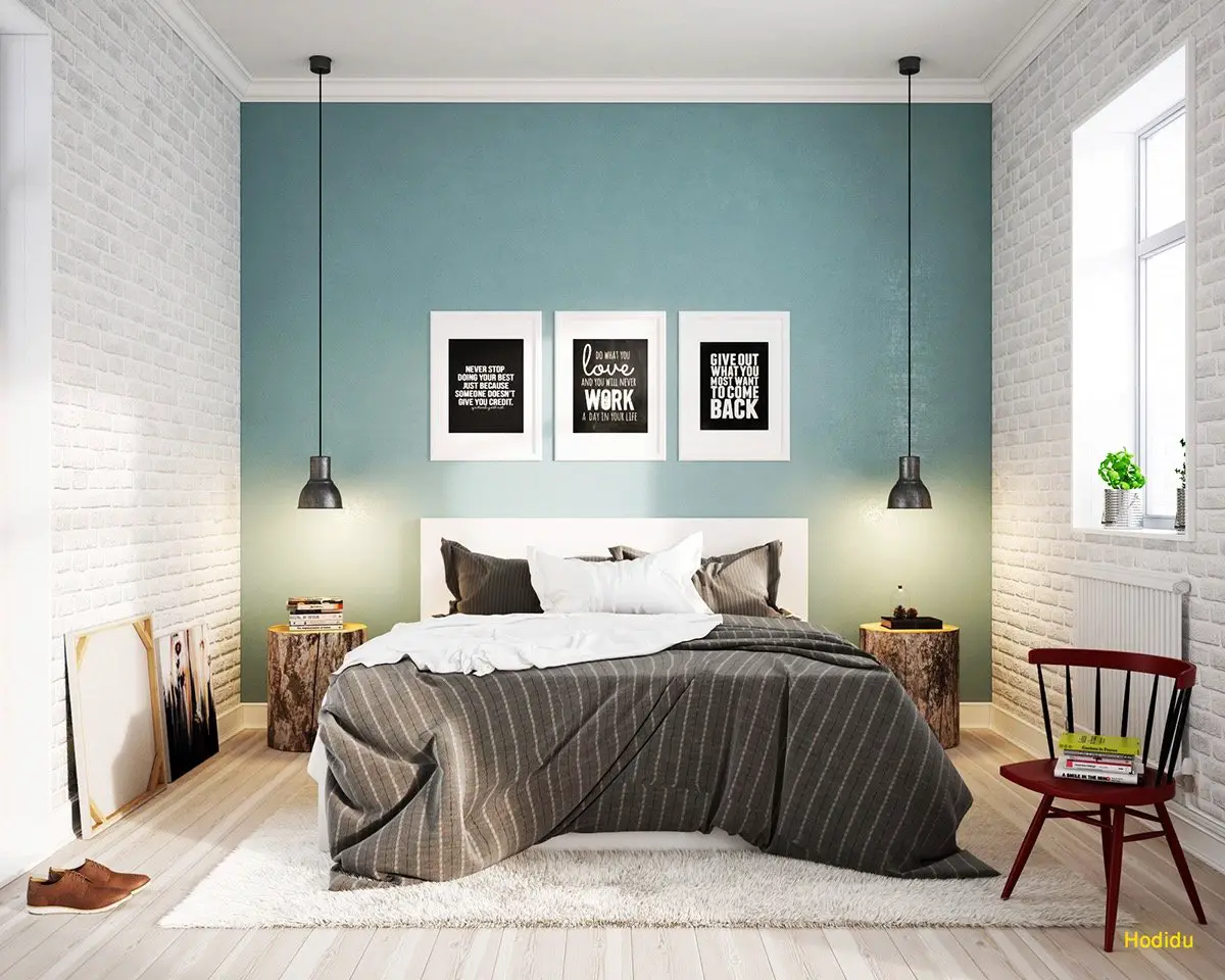 A Scandinavian-inspired bedroom with teal walls and wooden floors.