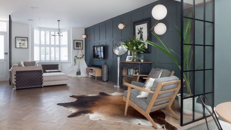 Modernize your home with a living room featuring wooden floors and a cowhide rug.