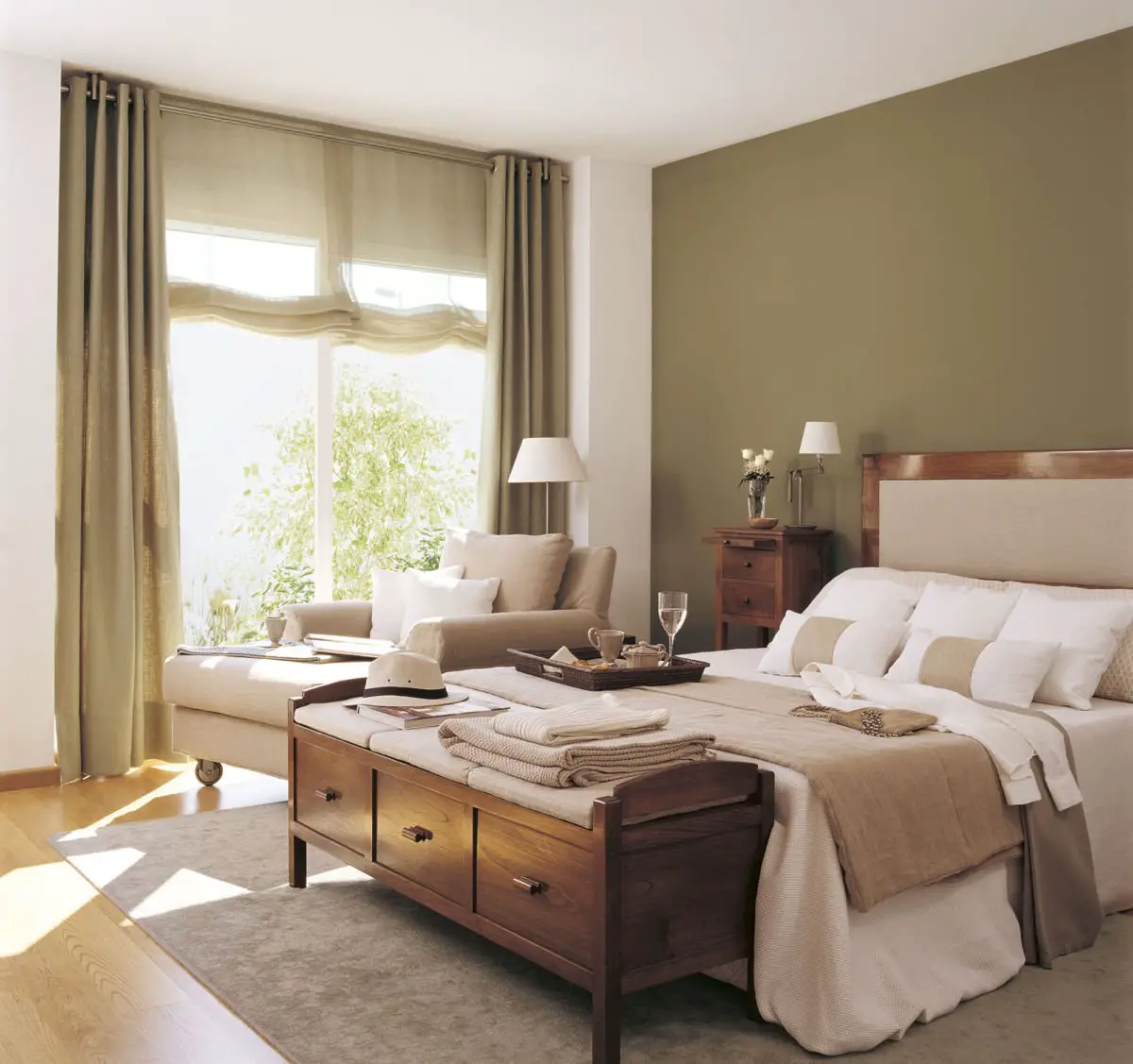 A bedroom with green walls and white furniture gets a fresh coat of painting.