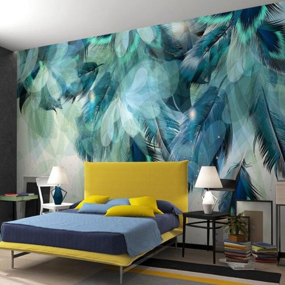 A luxurious bedroom with a blue and yellow wall mural.
