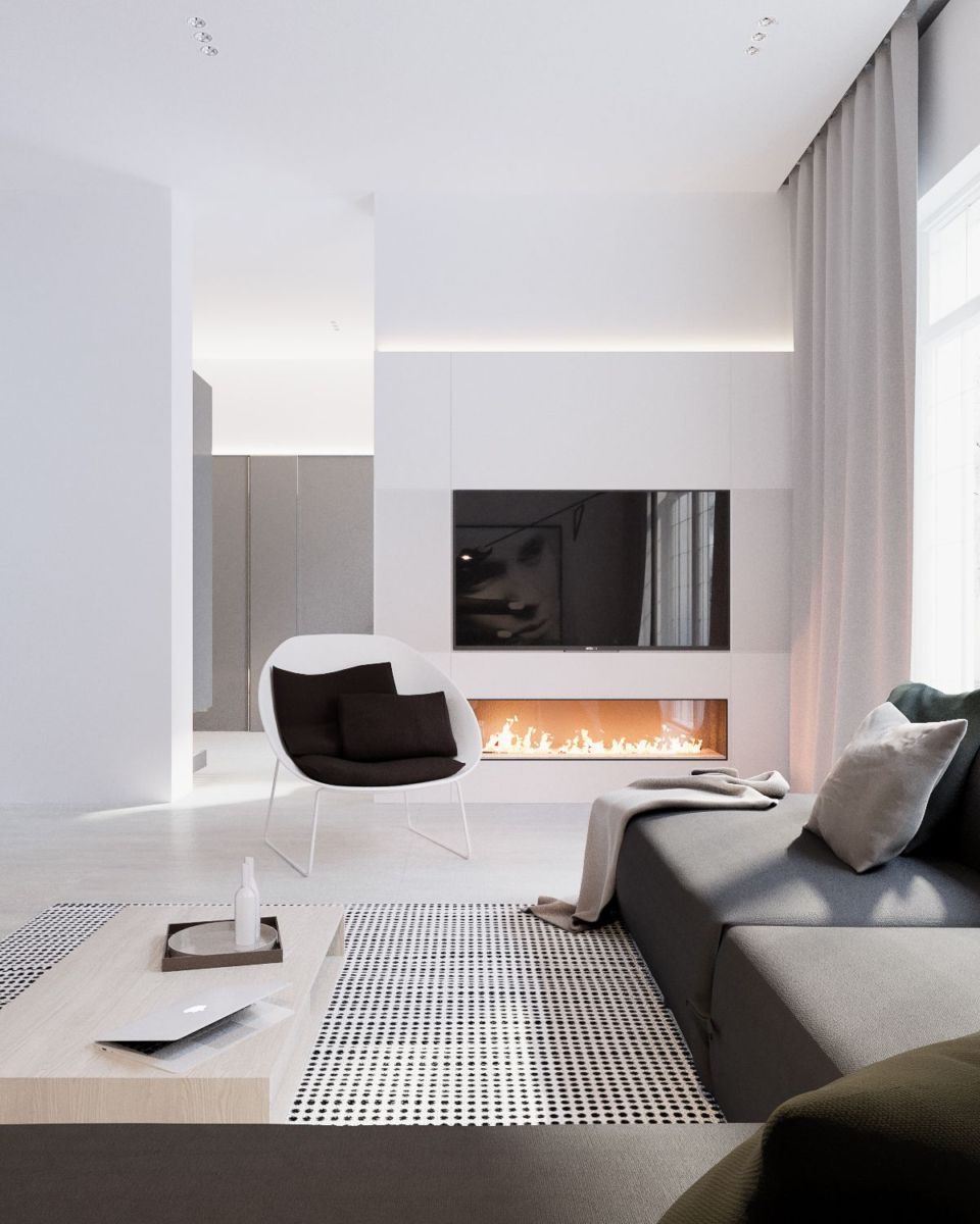 A stunning modern living room with white furniture and a fireplace.