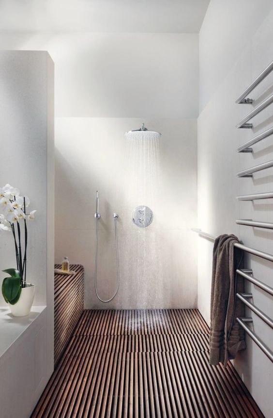 A wooden-floor shower room.