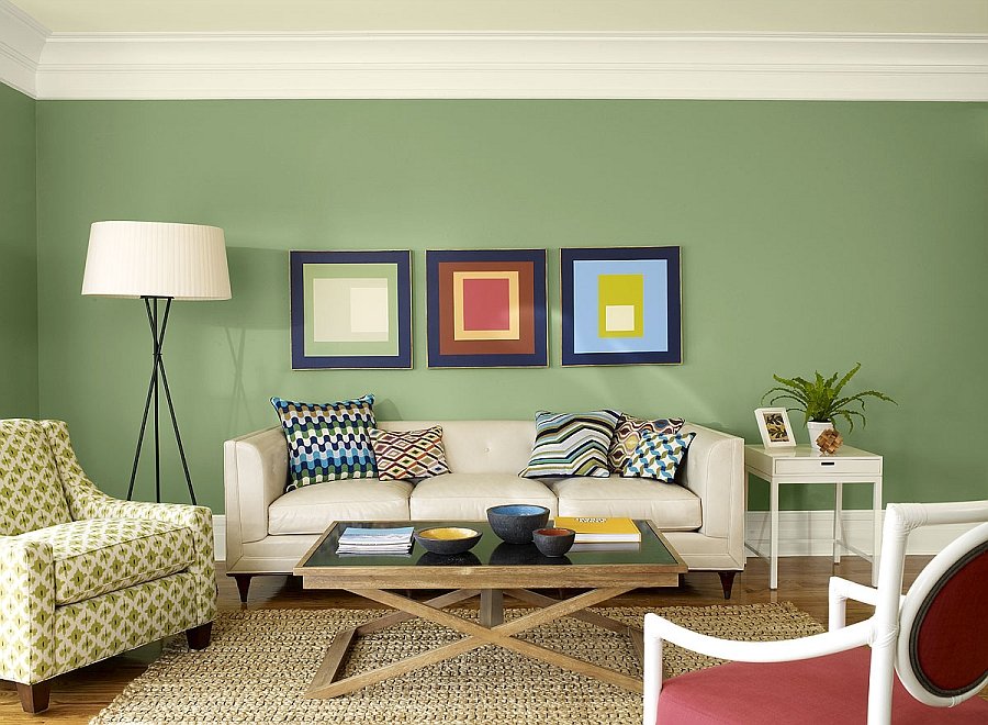 A living room with inspirational green walls.