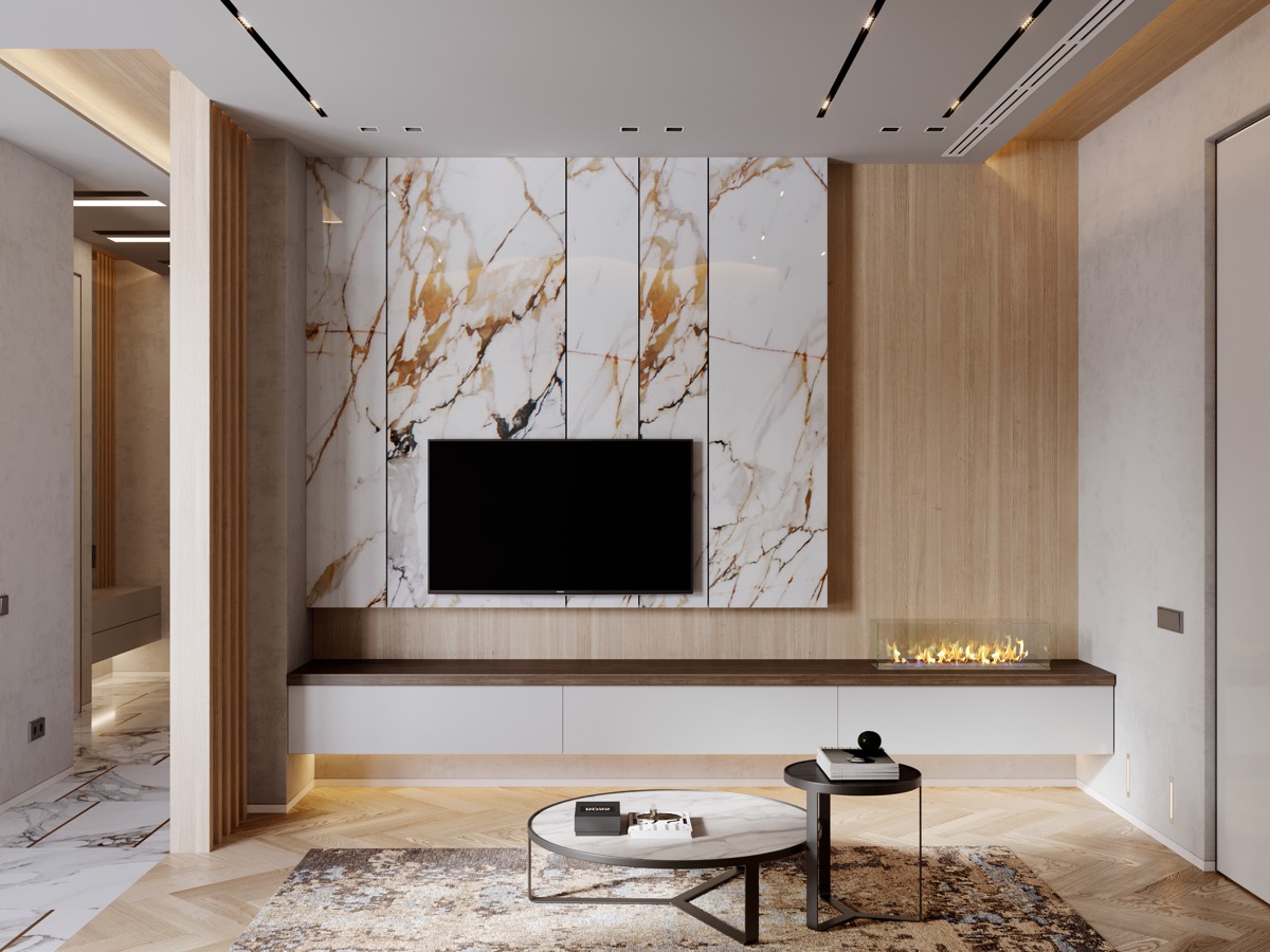 A stunning modern living room with marble walls and a TV.