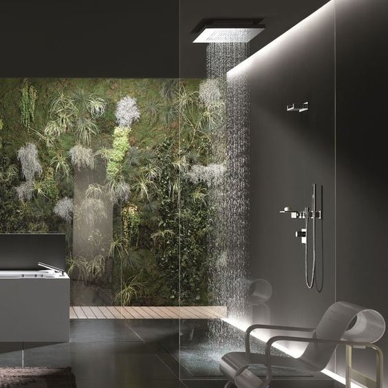 A contemporary bathroom with a waterfall shower head showcasing innovative shower room designs.