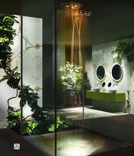 A glass shower with plants.