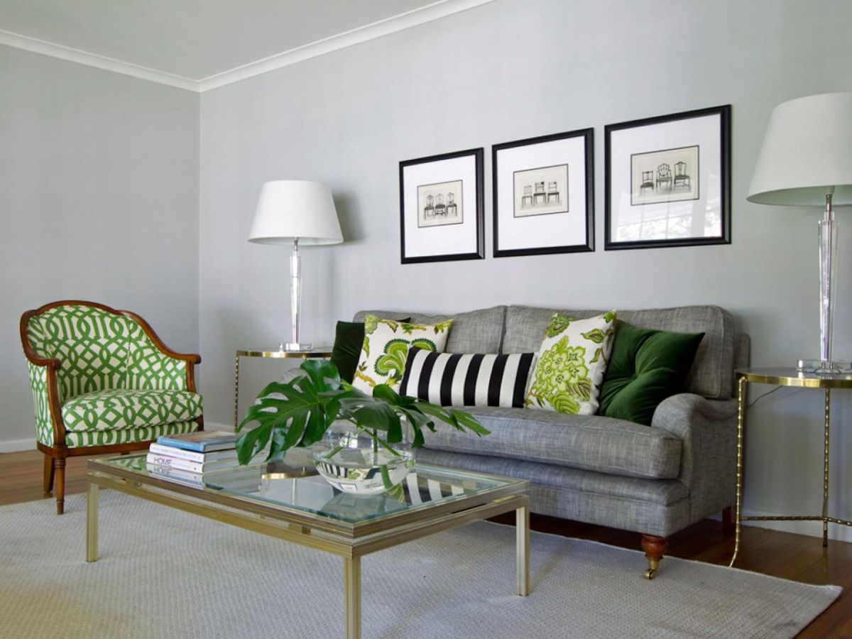 A green living room with gray accents.