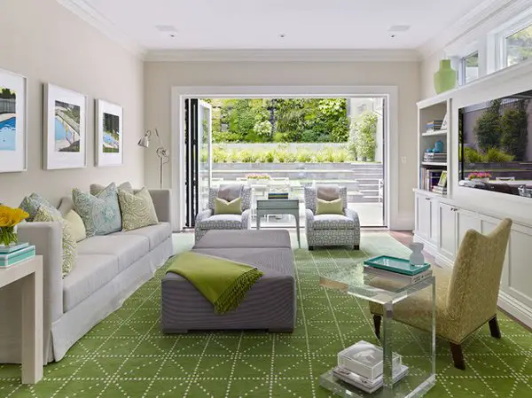 An inspirational living room with green carpet and furniture.