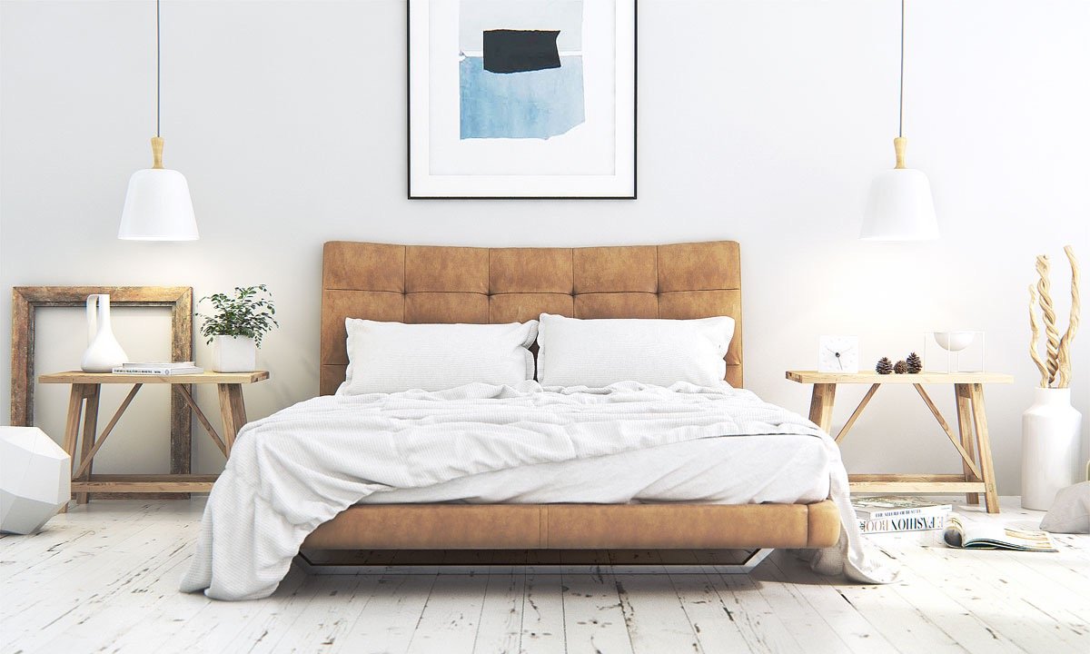 A Scandinavian-inspired bedroom with a bed and a painting on the wall.