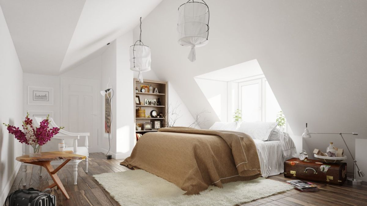 A Scandinavian-inspired bedroom with wooden floors and a bed.