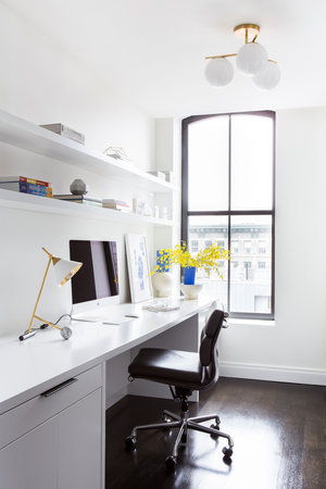 A white and black home office with a desk and chair providing inspirational workspace.