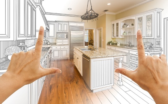 Two hands pointing at a kitchen drawing for home projects.