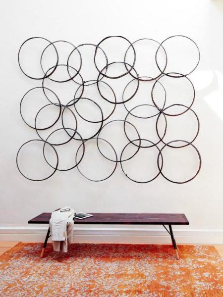 A wall of circles in a living room.