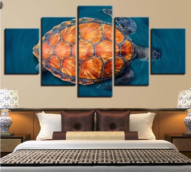 A tropical bedroom with a sea turtle on the wall.