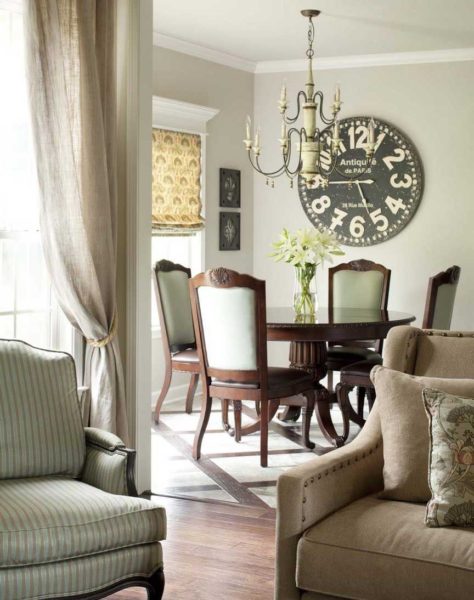 A living room with a clock on the wall.