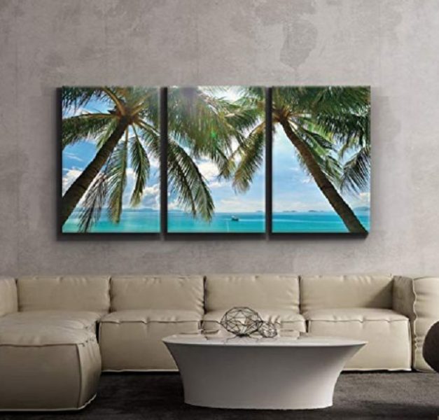 A tropical living room with three palm trees on the wall.