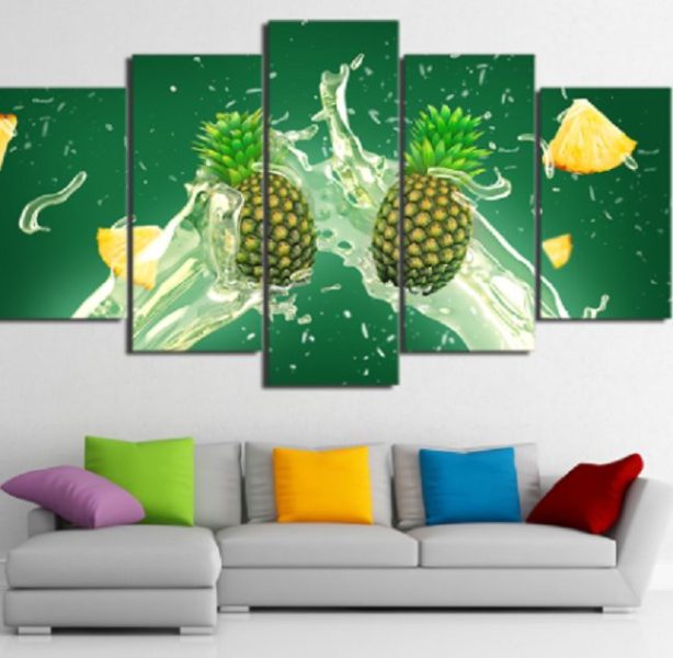 Tropical pineapples splashing on green canvas wall art.