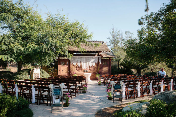 San Diego outdoor wedding ceremony set up with chairs and trees.