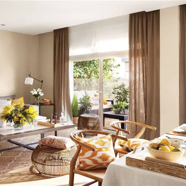 A living room with beige curtains.