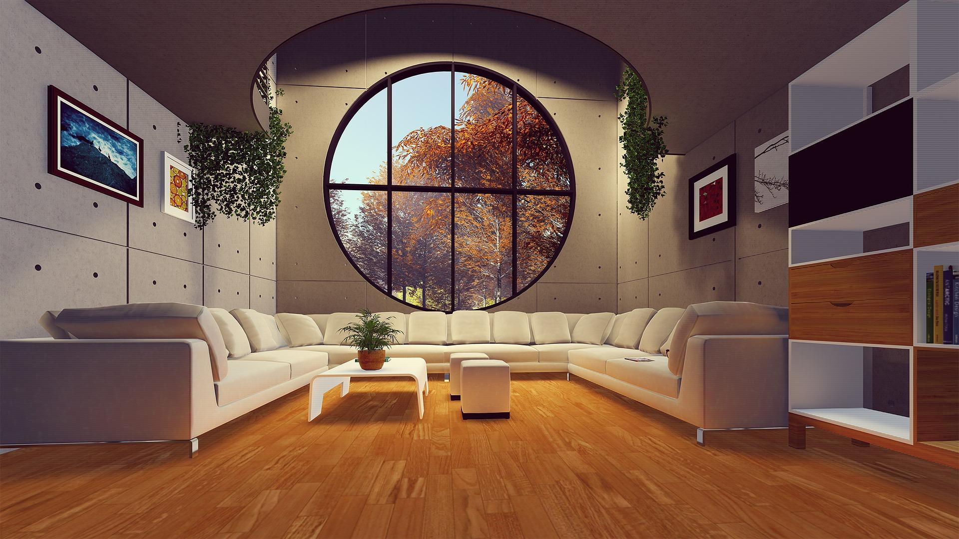 A living room with hardwood flooring and a large window.