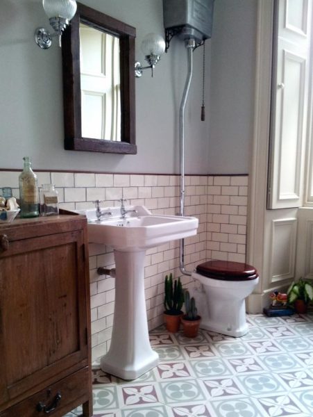 A bathroom with a sink and furniture.