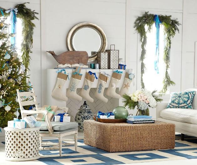A Christmas-decorated living room in blue and white.
