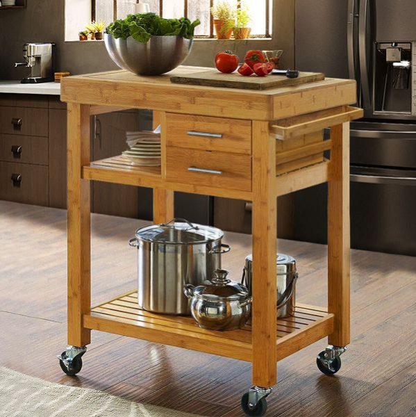 A kitchen cart with pots and pans, maximizing kitchen space.