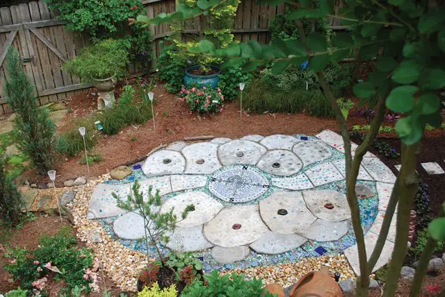 A DIY garden with a large stone circle in the middle.