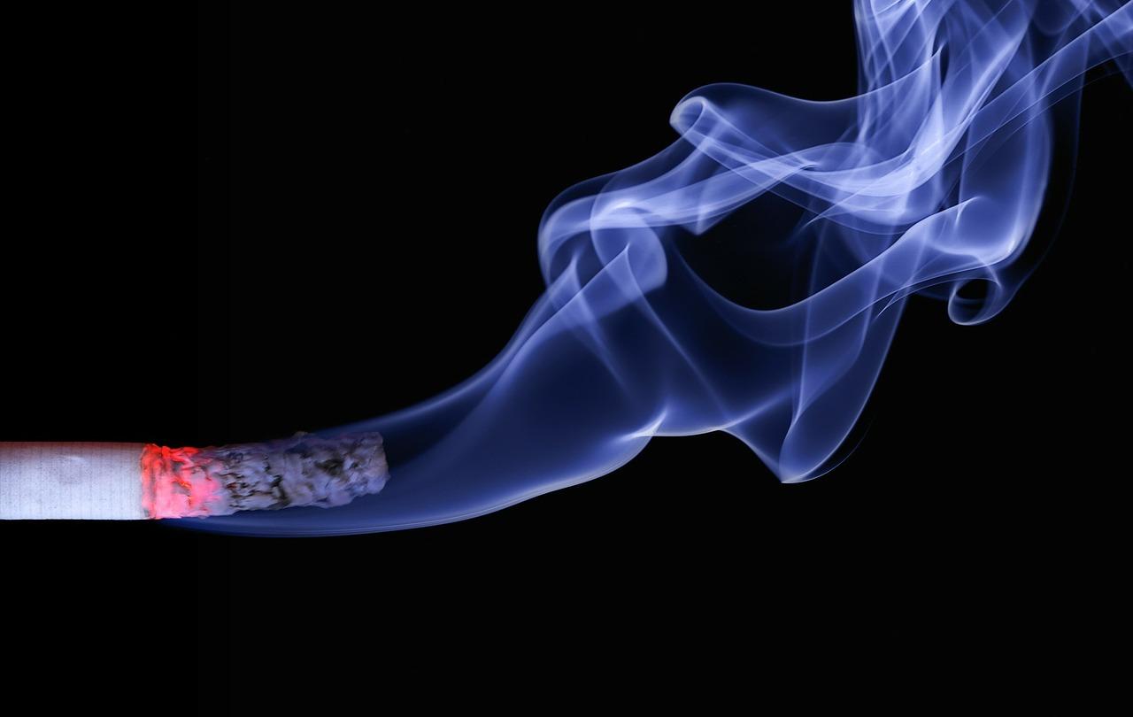 A smoky cigarette against a black background.