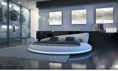 A modern bedroom with a circular bed.