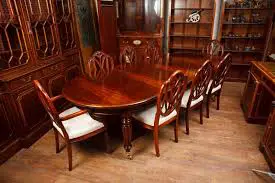 A dining room with a solid wood table and chairs.