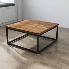 A square coffee table on a hardwood floor.